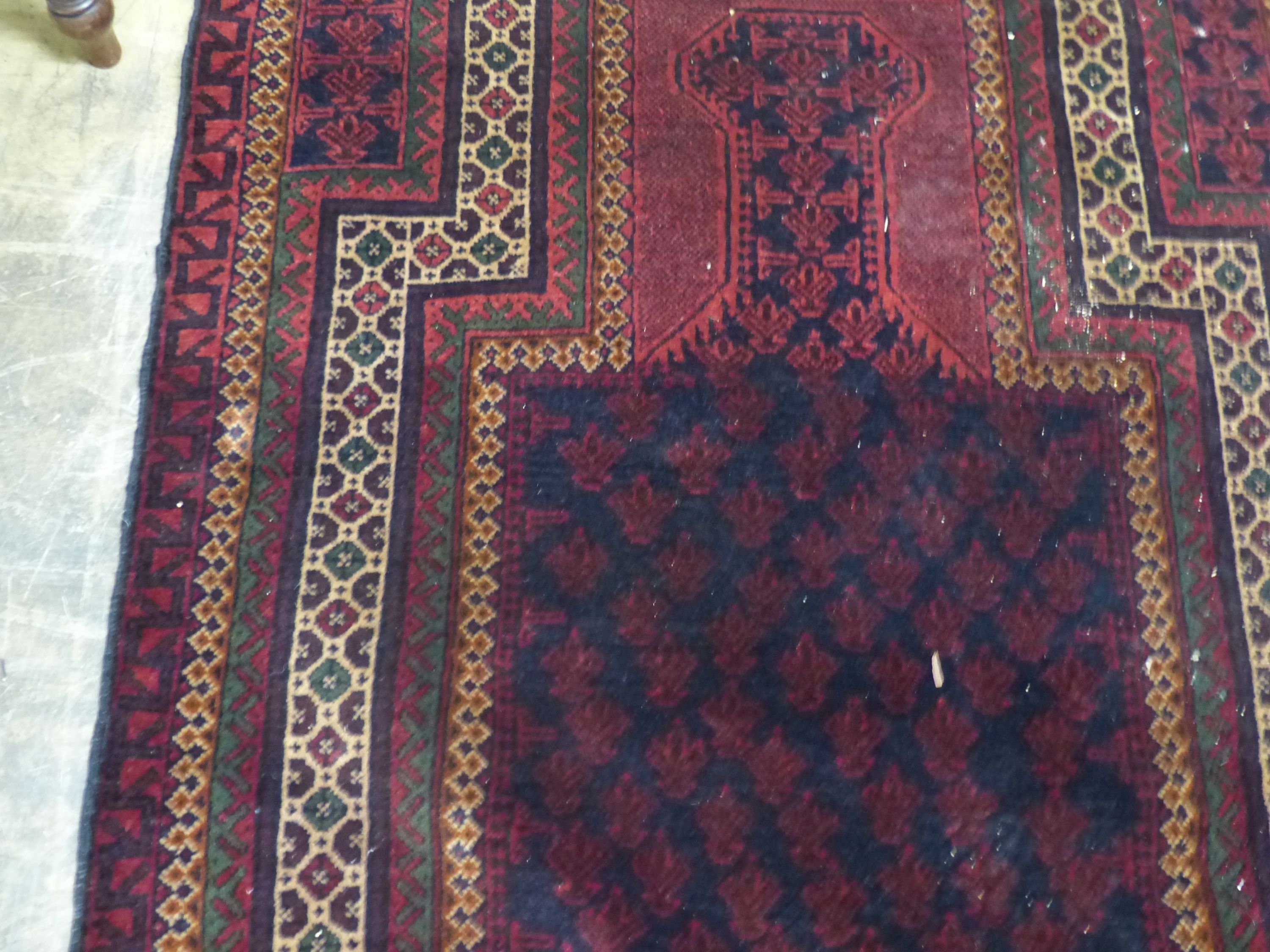 A Belouch red ground prayer rug, 146 x 90cm